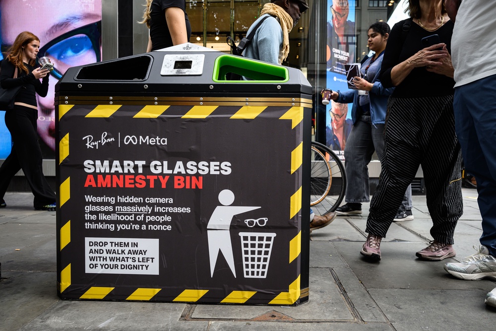 A fake sign on a bin calling for a 'Smart Glasses Amnesty on 10 September, 2026 in London, England (Getty)