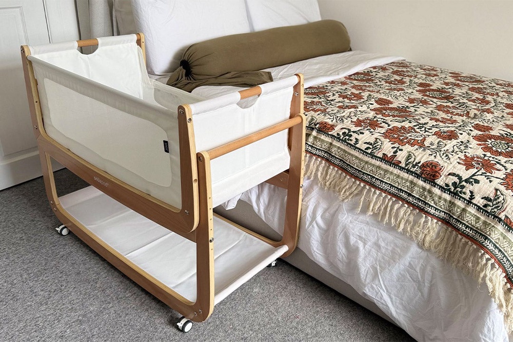 The SnuzPod allows your baby to sleep safely while still being right next to you (Sarah Jones/The Independent)