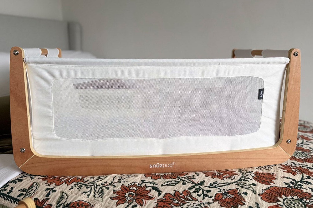 The bassinet can be removed from the frame, making it easy to move around the home (Sarah Jones/The Independent)