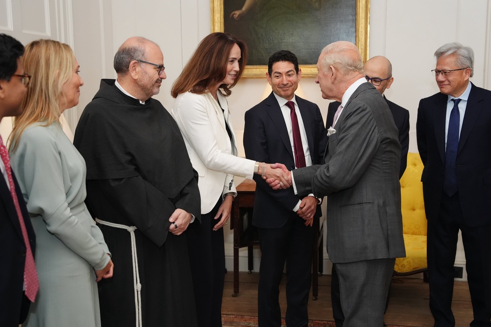 King Charles III shakes hands with chief financial officer of OpenAI Sarah Friar during a meeting for leaders from the artificial intelligence (AI) sector (Getty)