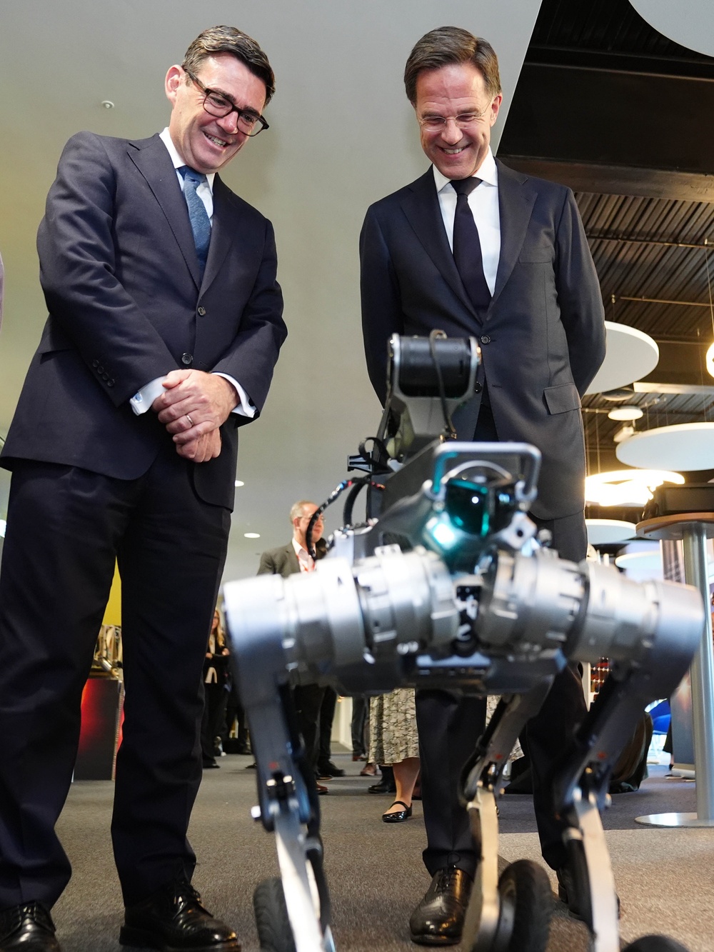 Prime Minister Andy Burnham and Nato chief Mark Rutte look at a robotic dog during a visit to see RAL Space in Didcot (Stefan Rousseau/PA) (PA Wire)