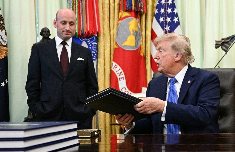 Trump pictured with key advisor Stephen Miller, largely seen as the architect of the administration’s immigration policy (AFP/Getty)