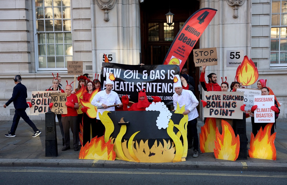 Fossil Free London activists protest outside the Department for Energy Security And Net Zero on Thursday as the Britain's Government faces growing pressure not to approve new North Sea oil and gas (Reuters)
