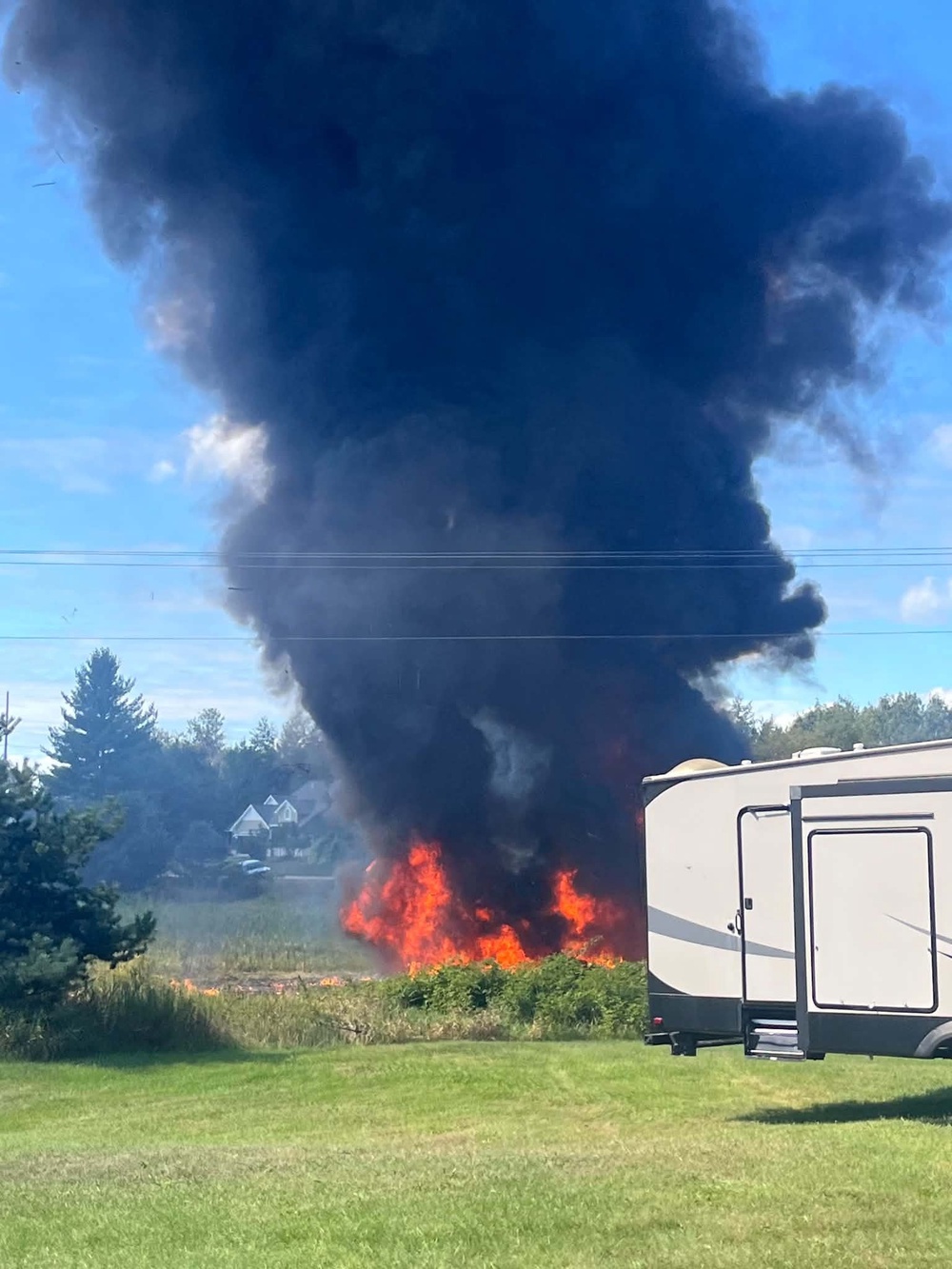 Smoke rises after an F-16 fighter jet crashed in a rural area near Traverse City, Mich., Thursday, Sept. 17, 2026 (Rebecca Lamberson)