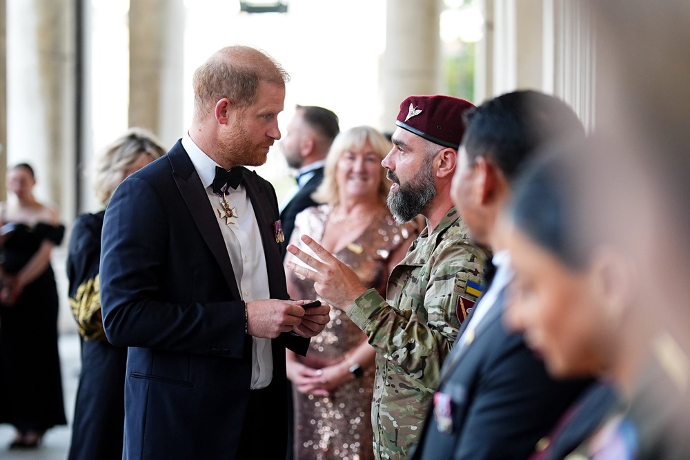 Harry speaks to a guest at the Invictus Spirit Awards (Aaron Chown/PA) (PA Wire)