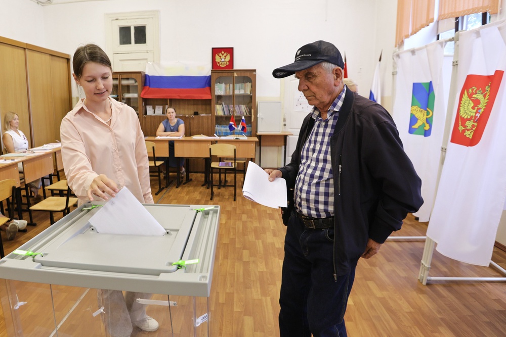 Voters cast their ballot for the parliamentary election in Vladivostok, Russia, Friday (AP)
