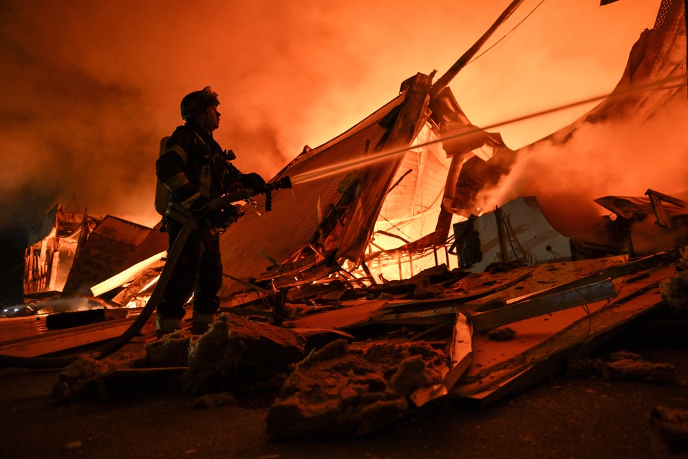 A firefighter works at the site of a shopping mall which was hit by a late evening Russian drone strike in Zaporizhzhia, Ukraine September 17, 2026 (Reuters)