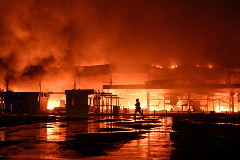 A firefighter works at the site of a shopping mall which was hit by a late evening Russian drone strike in Zaporizhzhia, Ukraine September 17, 2026 (Reuters)