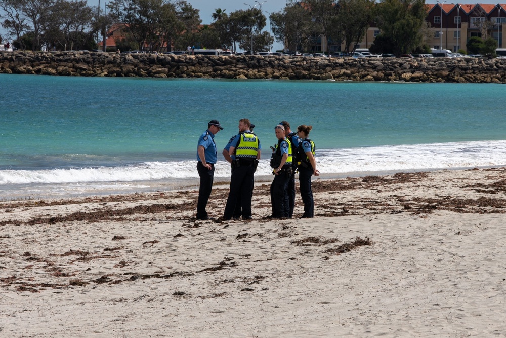 Police stand on Sorrento Beach (AP)