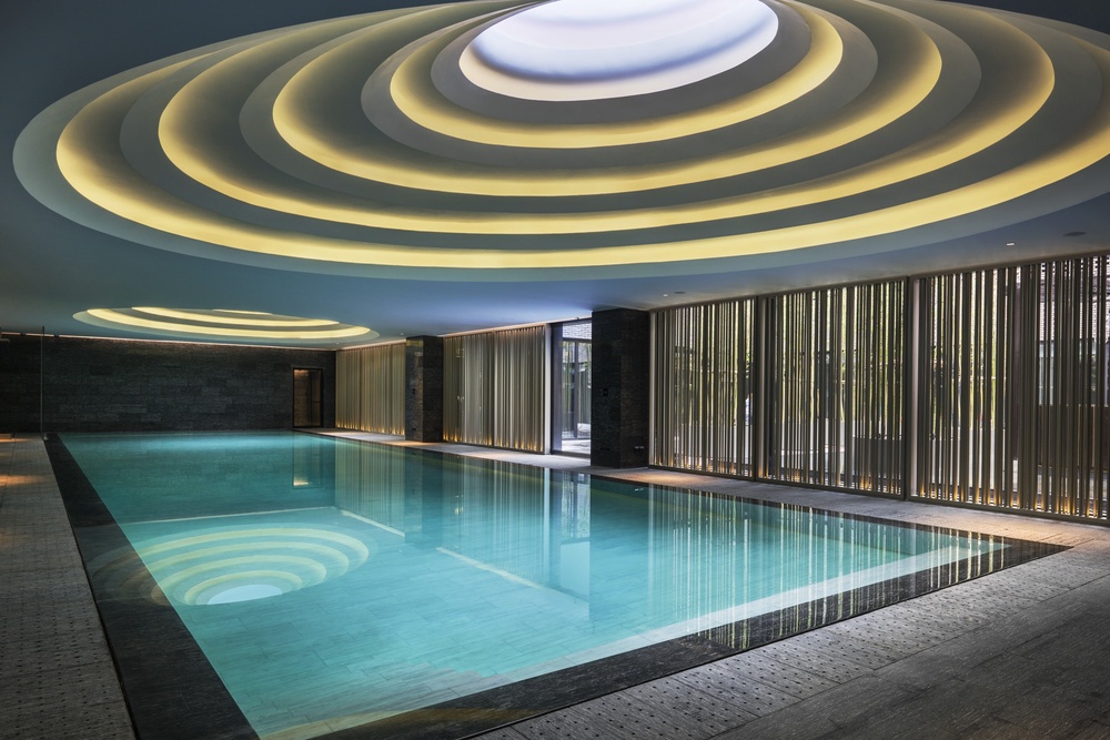 The pool is a relaxing space with gentle lighting (Upper House)