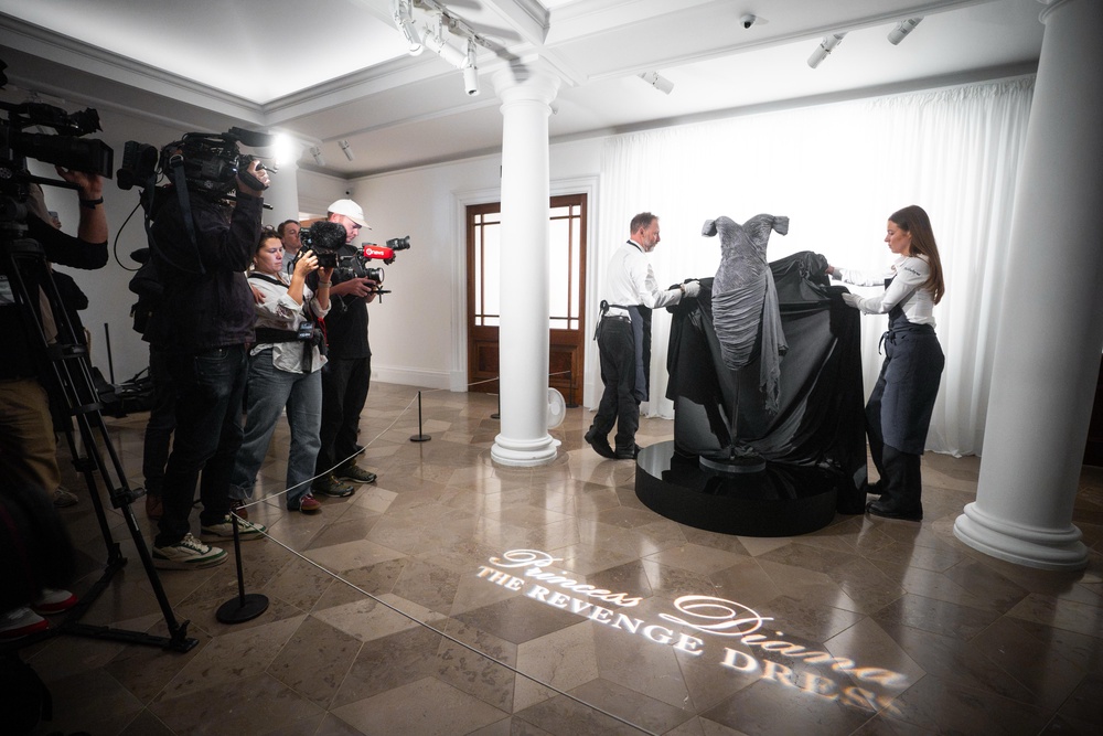 Auction house staff unveil Diana, Princess of Wales’s ‘revenge dress’ during a preview at Sotheby’s in central London (James Manning/PA) (PA Wire)