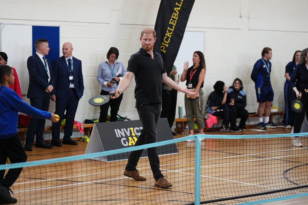 The Duke of Sussex plays pickleball during his visit to Ninestiles School (PA)