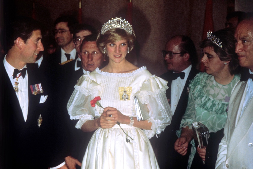 Diana, with Charles, attending a banquet during her tour of Canada in June 1983 (PA) (PA Archive)