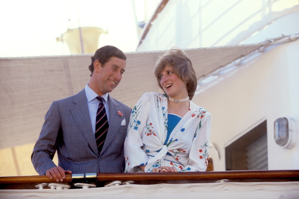 Charles and Diana in a merry mood aboard the Royal Yacht Britannia as she sails away from Gibraltar for the rest of their honeymoon. They flew in from Southampton to join the yacht for a Mediterranean cruise (PA) (PA Archive)