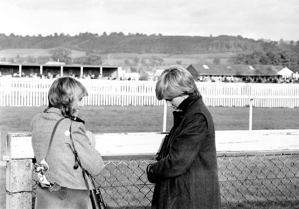 Camilla Parker-Bowles (left), who is now the Queen, and Lady Diana Spencer (later the Princess of Wales) at Ludlow racecourse in 1980 watching the Amateur Riders Handicap Steeplechase in which Charles was competing (PA) (PA Archive)