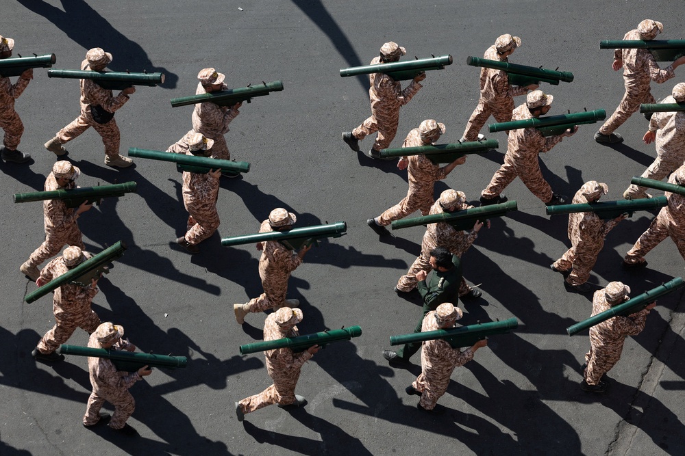 Members of Iranian militia forces (Basij) showed off their weaponry (Reuters)