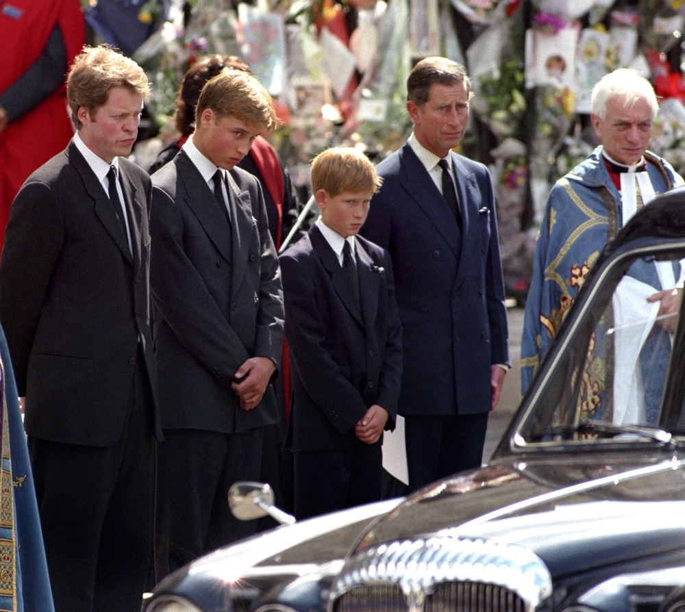 Earl Spencer, Prince William, Prince Harry and the then-Prince of Wales, waiting as the hearse carrying the coffin of Diana, Princess of Wales prepares to leave (PA) (PA Archive)