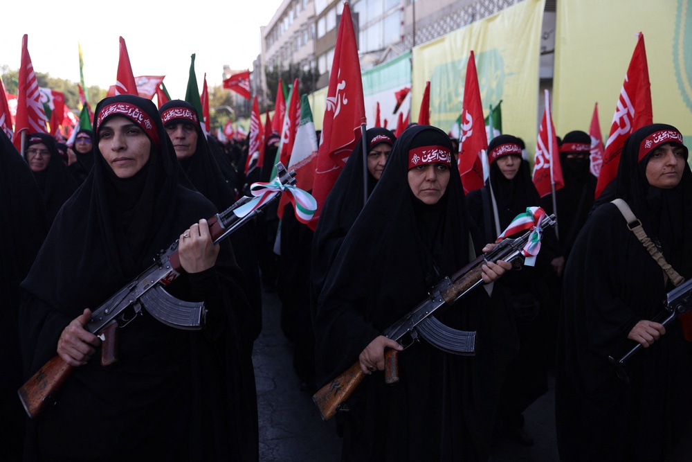 Female members of Iranian militia forces in Tehran on Friday (Reuters)