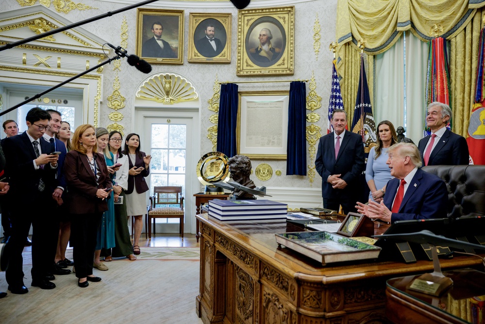 Trump takes questions from reporters Friday after saying he will ban certain media outlets that do not flatter him from having access to the White House in the future (Reuters)