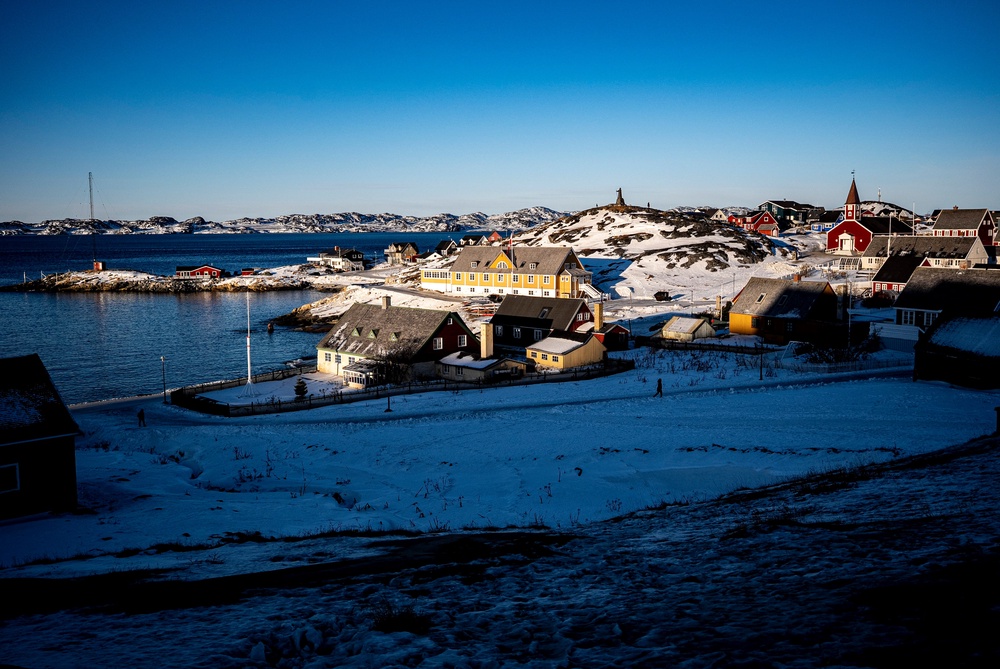 Low sun illuminates buildings in Nuuk. Greenland operates as a semi-autonomous territory of Nato member Denmark (PA)