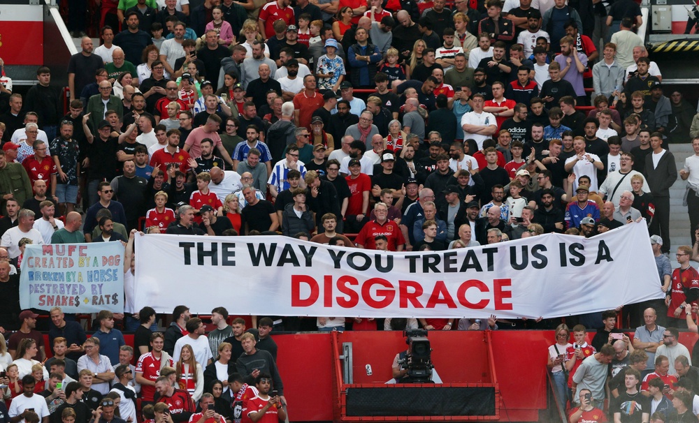 Fans protested against the current ownership before their 1-0 defeat to Manchester City last week with a banner that read 'the way you treat us is a disgrace' (Reuters)