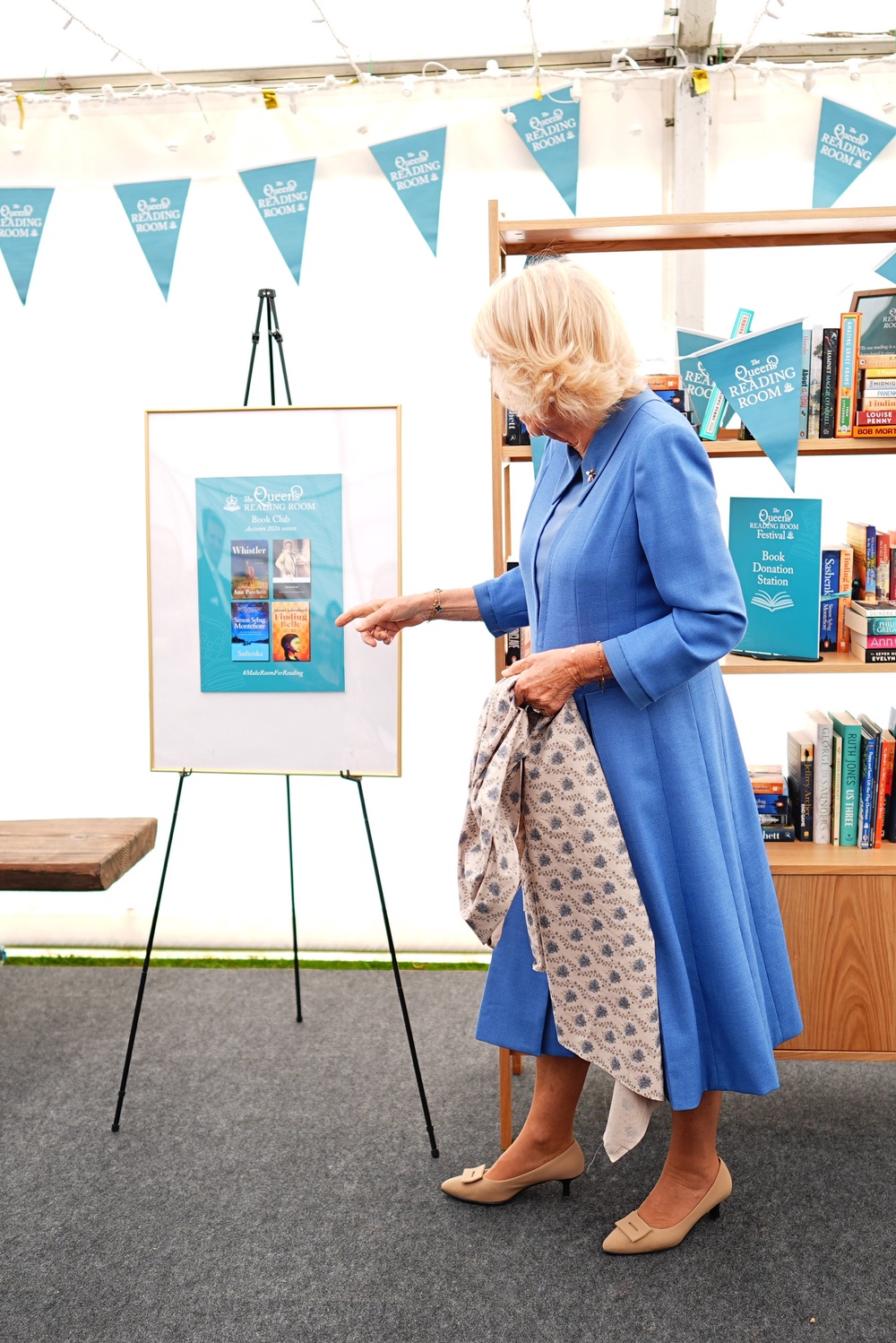 The Queen as she unveils the titles for the four new books in The Queen’s Reading Room Book Club Autumn 2026 season (Aaron Chown/PA) (PA Wire)