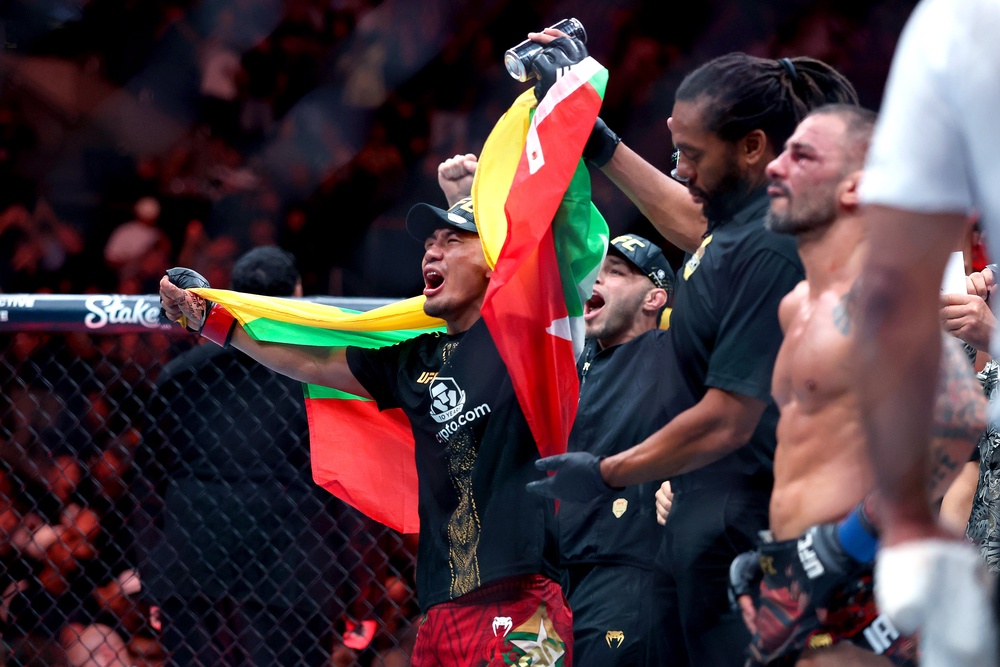 Joshua Van celebrates a second successful flyweight-title defence (Getty)