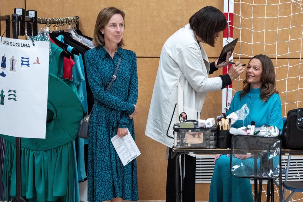Lady Victoria Starmerhaving her hair and make-up done alongside the runway (Jeff Moore/PA)