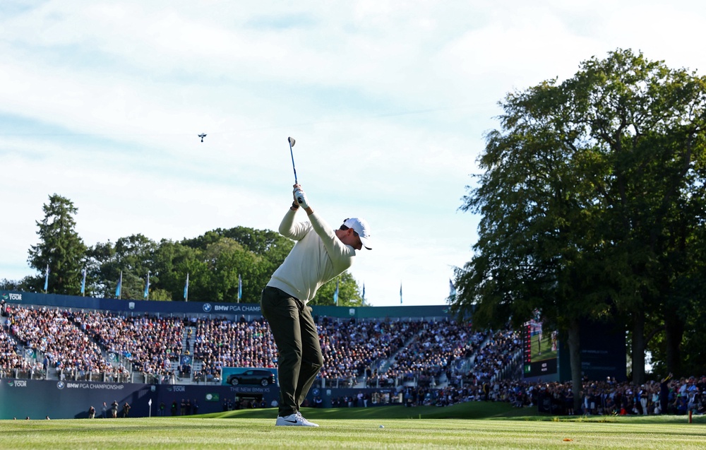McIlroy hits his approach to the 18th green (Reuters)