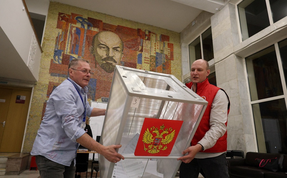 Members of a local electoral commission empty a ballot box before counting votes after the closure of a polling station (Reuters)