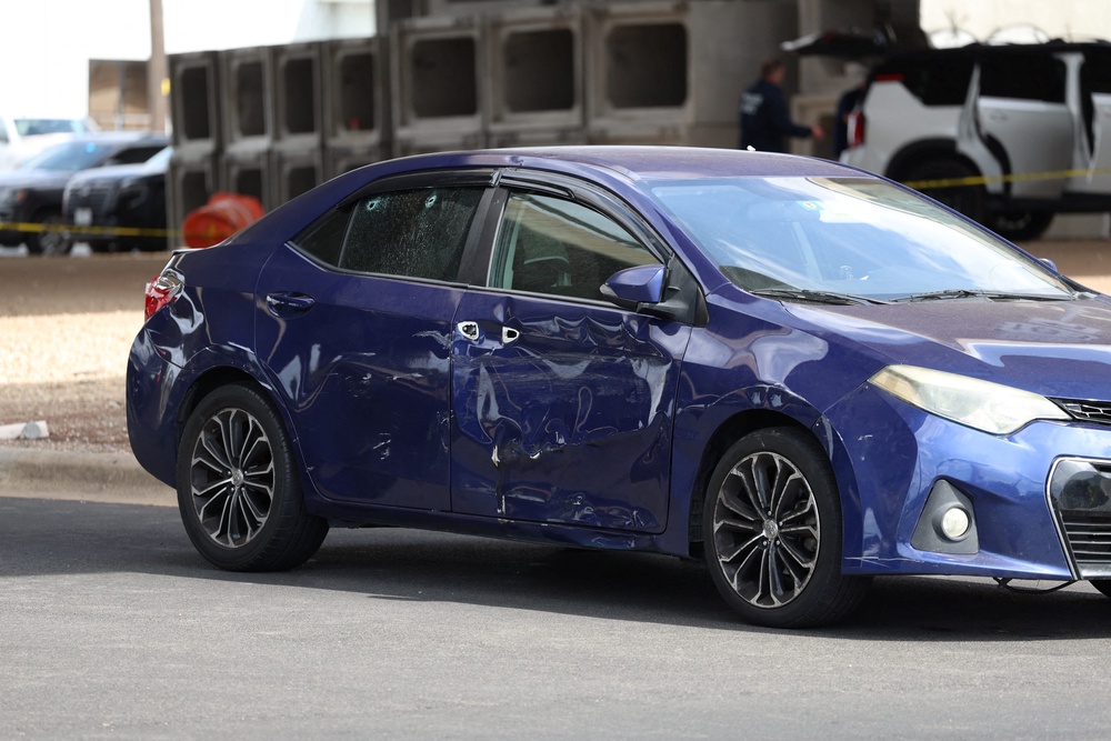 A damaged car after a US Immigration and Customs Enforcement (ICE) agent shot a person earlier in the day in Austin (Reuters)