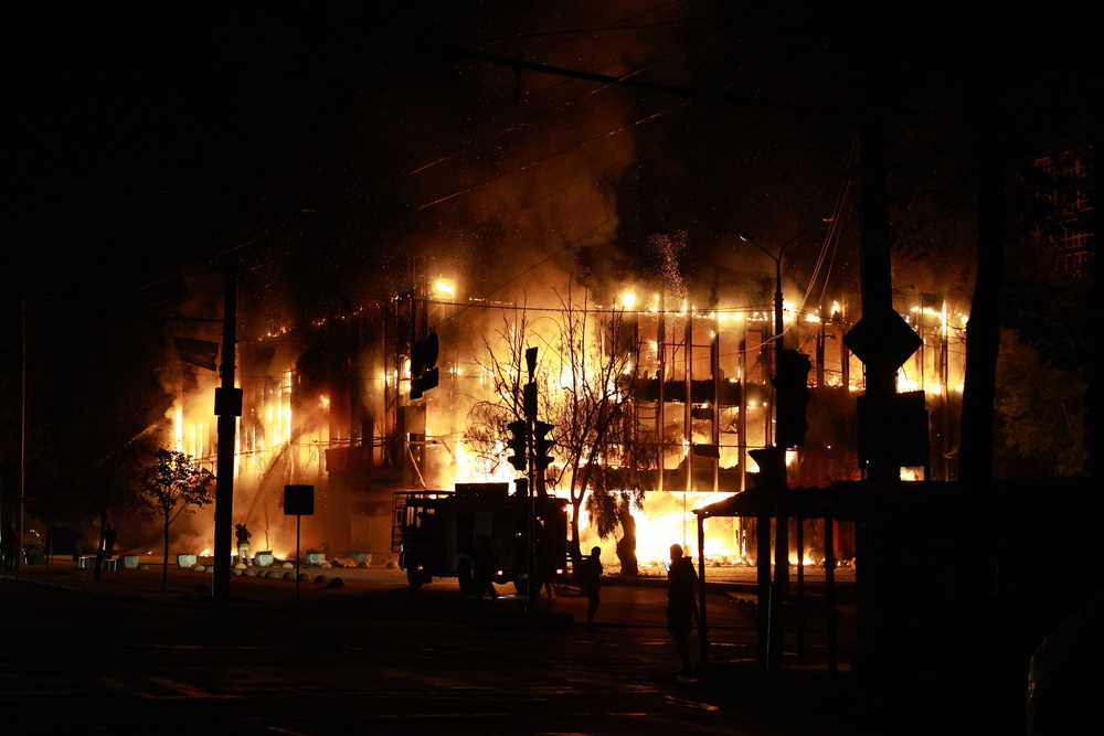 Rescue workers put out a fire at the Intrade trade centre after a Russian drone strike on Zaporizhzhia, Ukraine, Monday, Sept. 21, 2026 (AP)