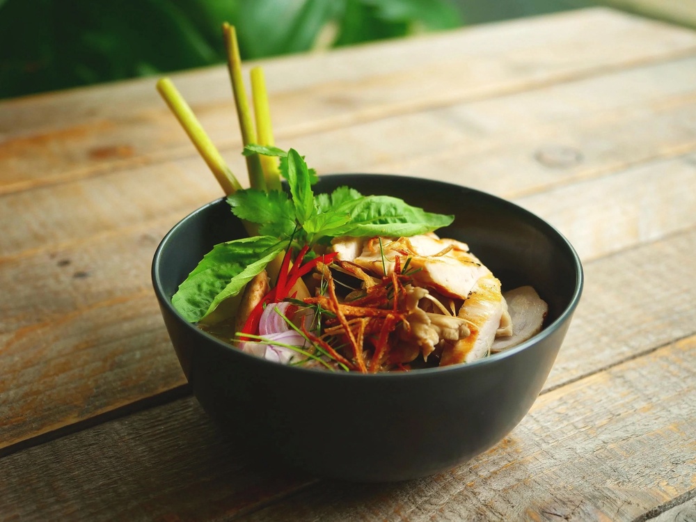 Smoked chicken, wild mushrooms and squash make for a deeply aromatic coconut soup sharpened with lime and chilli (Sebby Holmes/Farang/Payst)