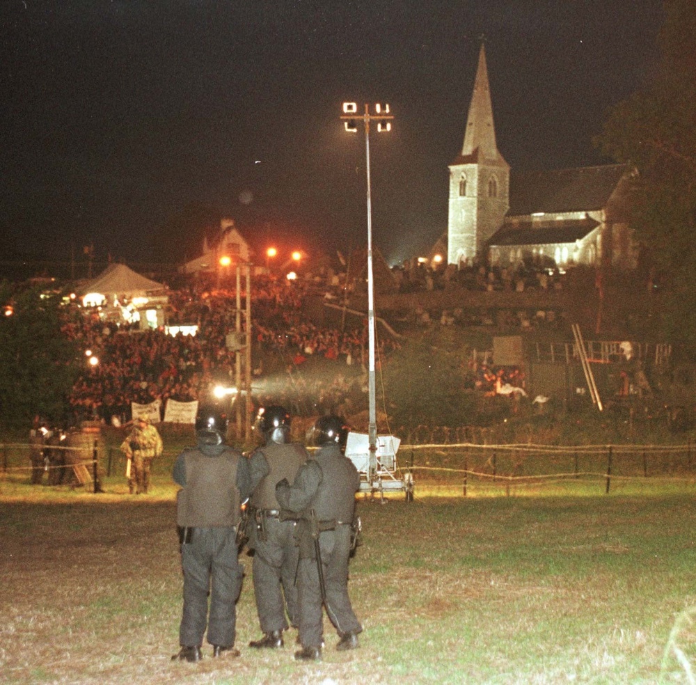 Loyalists confront riot police during the stand-off at Drumcree Church, in Portadown in the 1990s (PA) (PA Archive)