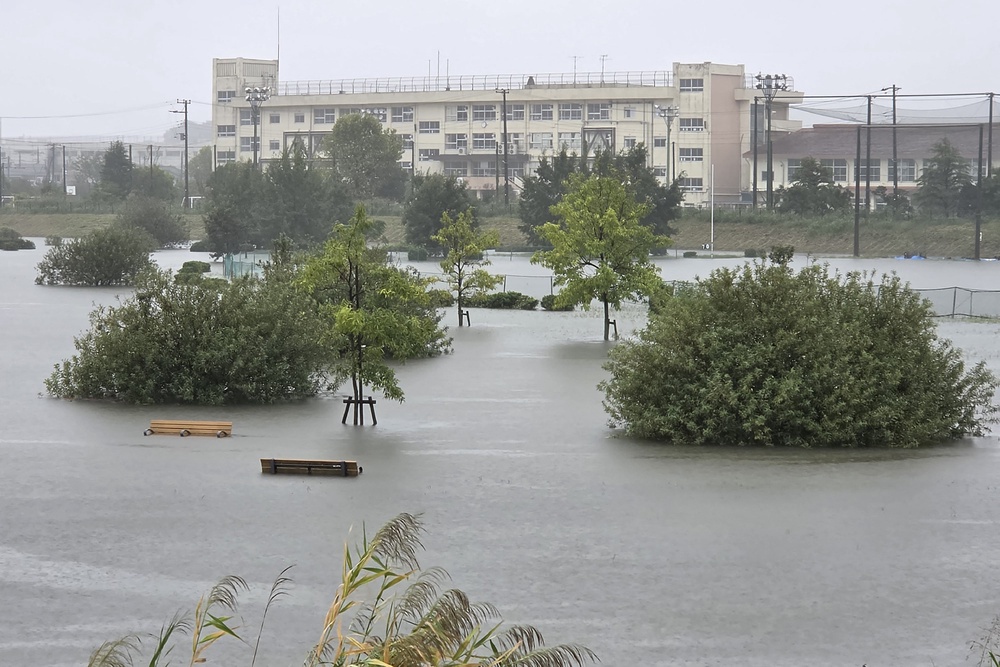 Flooding inundates a park as heavy rain falls amid weather patterns due to Typhoon Dujuan in Ichikawa city, Chiba Prefecture on 21 September 2026 (AFP/Getty)