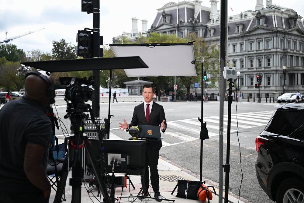 After the president banned MS NOW, Politico and CNN from the White House, reporters from those outlets were seen broadcasting from areas outside the White House grounds (AFP/Getty)