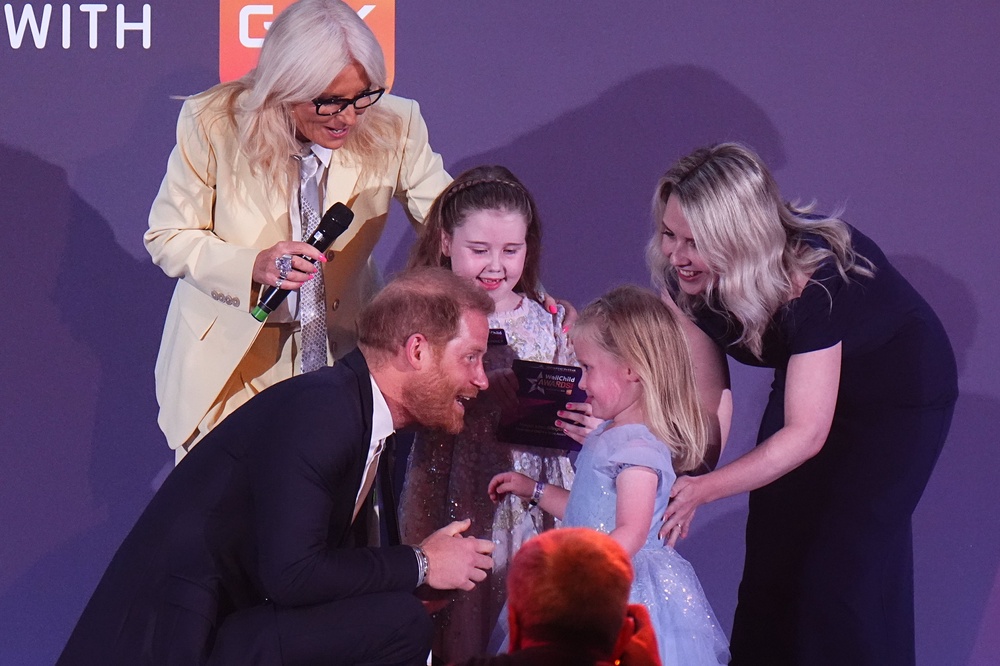 The Duke of Sussex hugs Margot Jones-Billington’s sister Adelaide during the WellChild Awards 2026 (Aaron Chown/PA) (PA Wire)