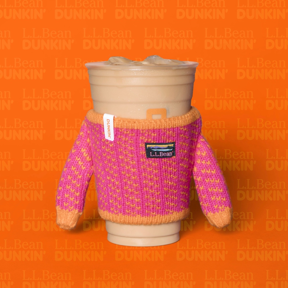 Starting Tuesday, customers can get a mini sweater in the brand’s signature colors, pink and orange, for their Dunkin’ cup (Dunkin')