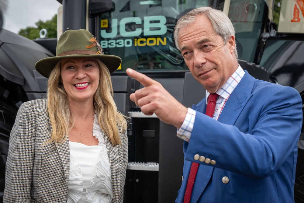 Laura Anne Jones announces her defection to Reform UK at the 2025 Royal Welsh Show, alongside Reform leader Nigel Farage (Getty)