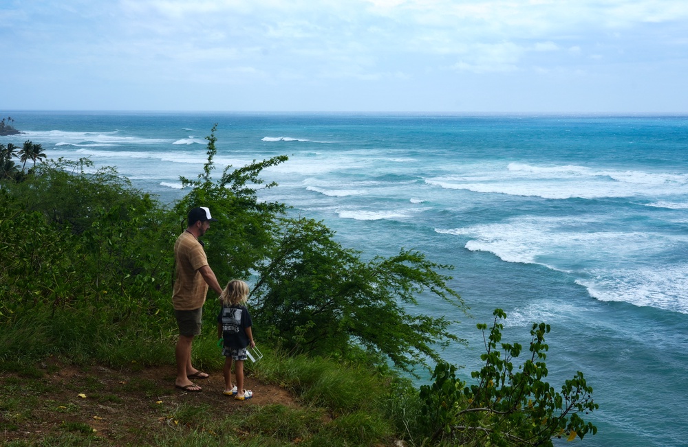 People watch waves build off Diamond Head Beach Park in Honolulu, Hawaii, on September 7, 2026, as surf generated by Tropical Storm Lowell begins to build along Oahu's south-facing shores (AFP/Getty)