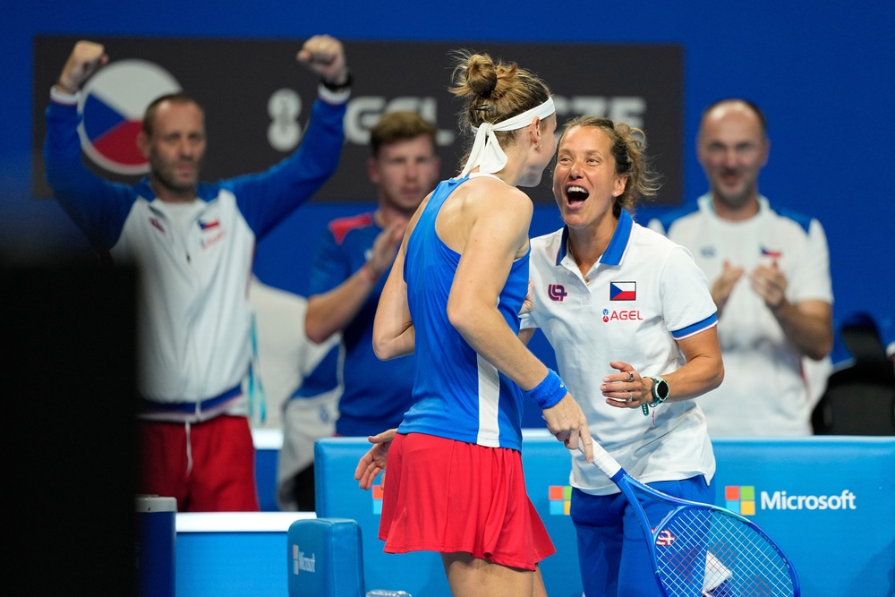 Marie Bouzkova celebrates her victory with captain Barbora Strycova (Andy Wong/AP) (AP)