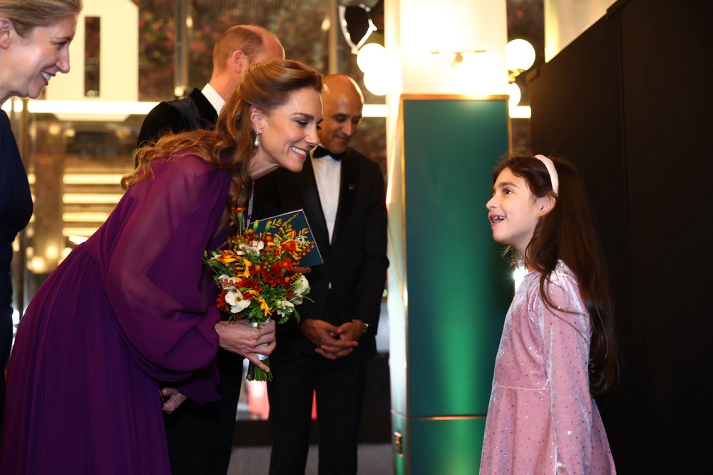 The Princess of Wales meets Evie Peters, seven, at the royal film performance and world premiere of Digger, at the Odeon Luxe in Leicester Square (Geoff Pugh/Daily Telegraph/PA)