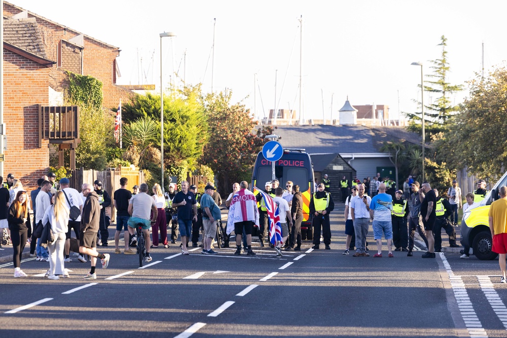 Police and protesters in Gosport, Hampshire, after officers closed off the access road to Haslar Marina (Trevor Adams/PA) (PA Wire)