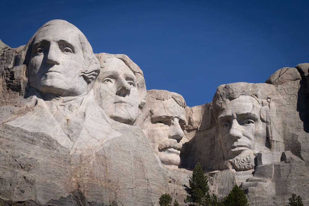 US presidents George Washington, Thomas Jefferson, Theodore Roosevelt and Abraham Lincoln tower over the landscape at Mount Rushmore (Getty)
