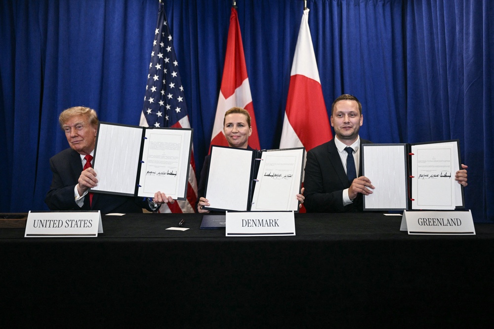 Trump, Denmark's Prime Minister Mette Frederiksen and Greenland's Prime Minister Jens-Frederik Nielsen sign a trilateral security deal  on the sidelines of the UN General Assembly (AFP via Getty Images)