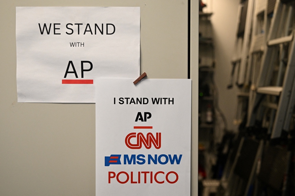 Flyers hang in the White House briefing room in Washington, DC, on September 21, following Trump's media ban (AFP via Getty Images)