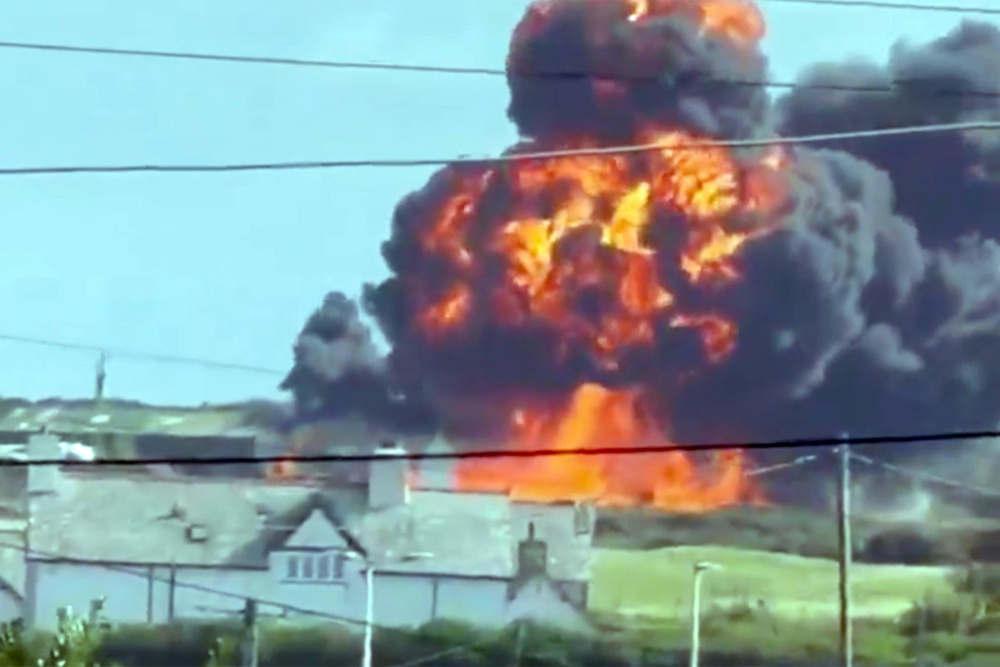 Pictures showed the jet descending before a huge ball of fire exploded (John Heyworth/Facebook)