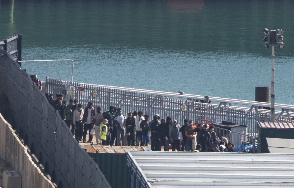 A group of people thought to be migrants are brought in to the Border Security Command compound in Dover, Kent (Gareth Fuller/PA) (PA Wire)