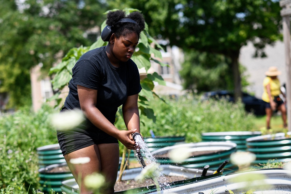 Gardening helps to reduce stress and symptoms of depression due to its repetitive movement and requirement to care for living things (AFP via Getty Images)