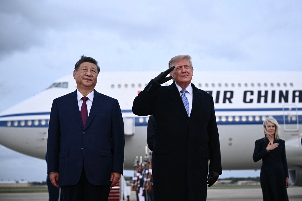 Trump winced as a U.S. military jet completed a flyover during Xi's arrival ceremony (AFP/Getty)